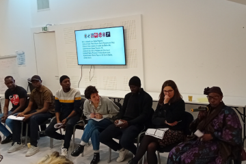De gauche à droite : Abderrahmane Sidibé, Muhamed Bah, Anthioumane Touré,  Laure Paradis (VoxPublic), Abdoulaye Sidibé, Fanélie Carrey-Conte, Mariama Sidibé. Crédit : Léanna Voegeli